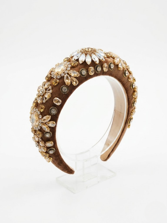 Diadema joya acolchada en color bronce dorado con cristales ámbar vista de perfil.