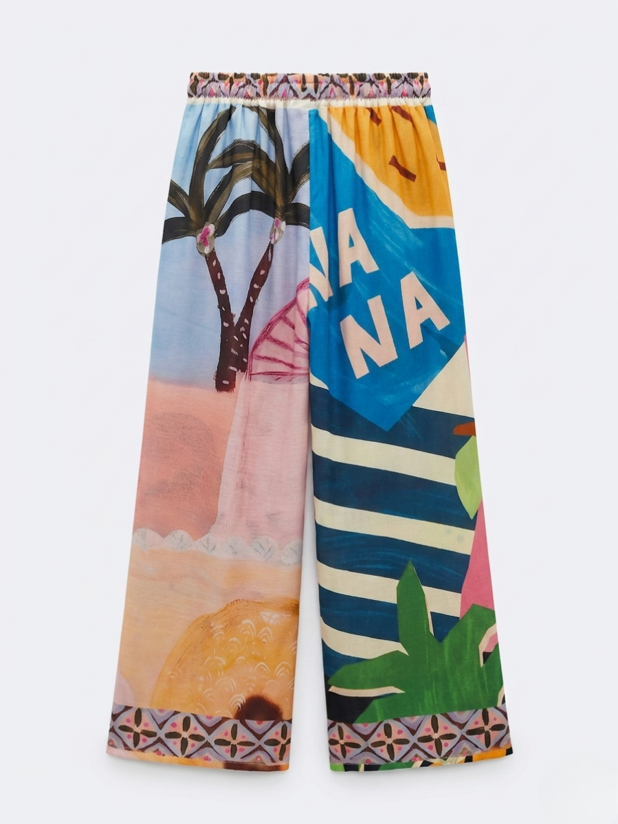 Pantalón de pernera ancha estirado en plano mostrando el contraste de colores y la cintura elástica.