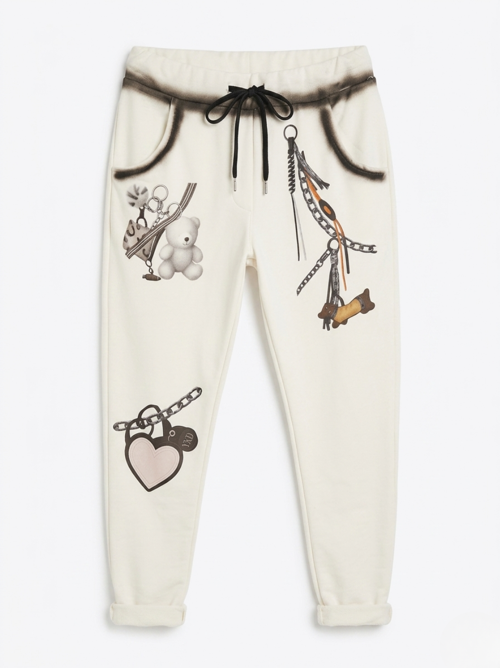 Pantalón blanco muy ajustado con diseño de graffiti negro y cordón ajustable en la cintura.