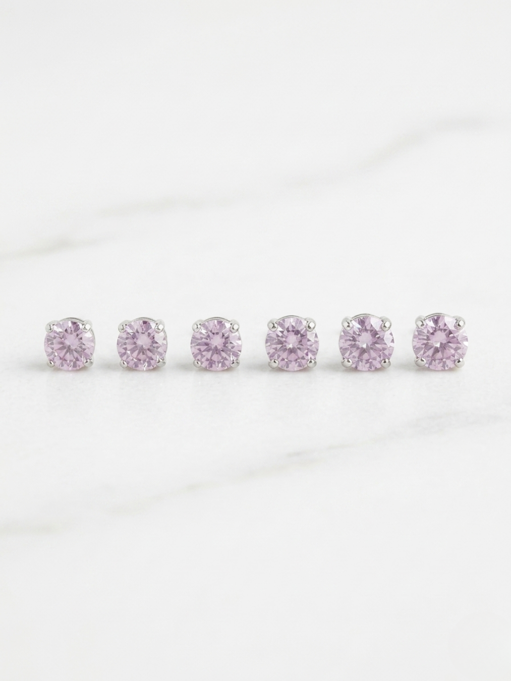 Pack de 3 pares de pendientes rosa palo con circonitas de diferentes tamaños de Angel Salvaje.