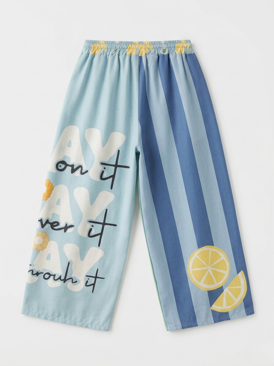 Parte trasera del pantalón asimétrico en plano con diseño de rayas y gráficos de rodajas de limón.